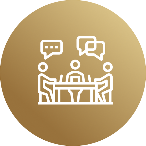 Group 569 A gold circle with three people sitting at a table